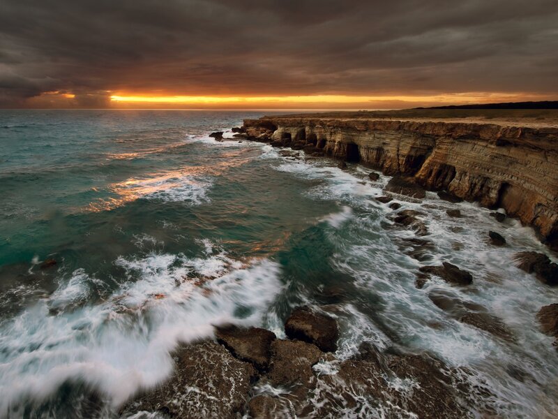 Cliffs at sunset by the sea