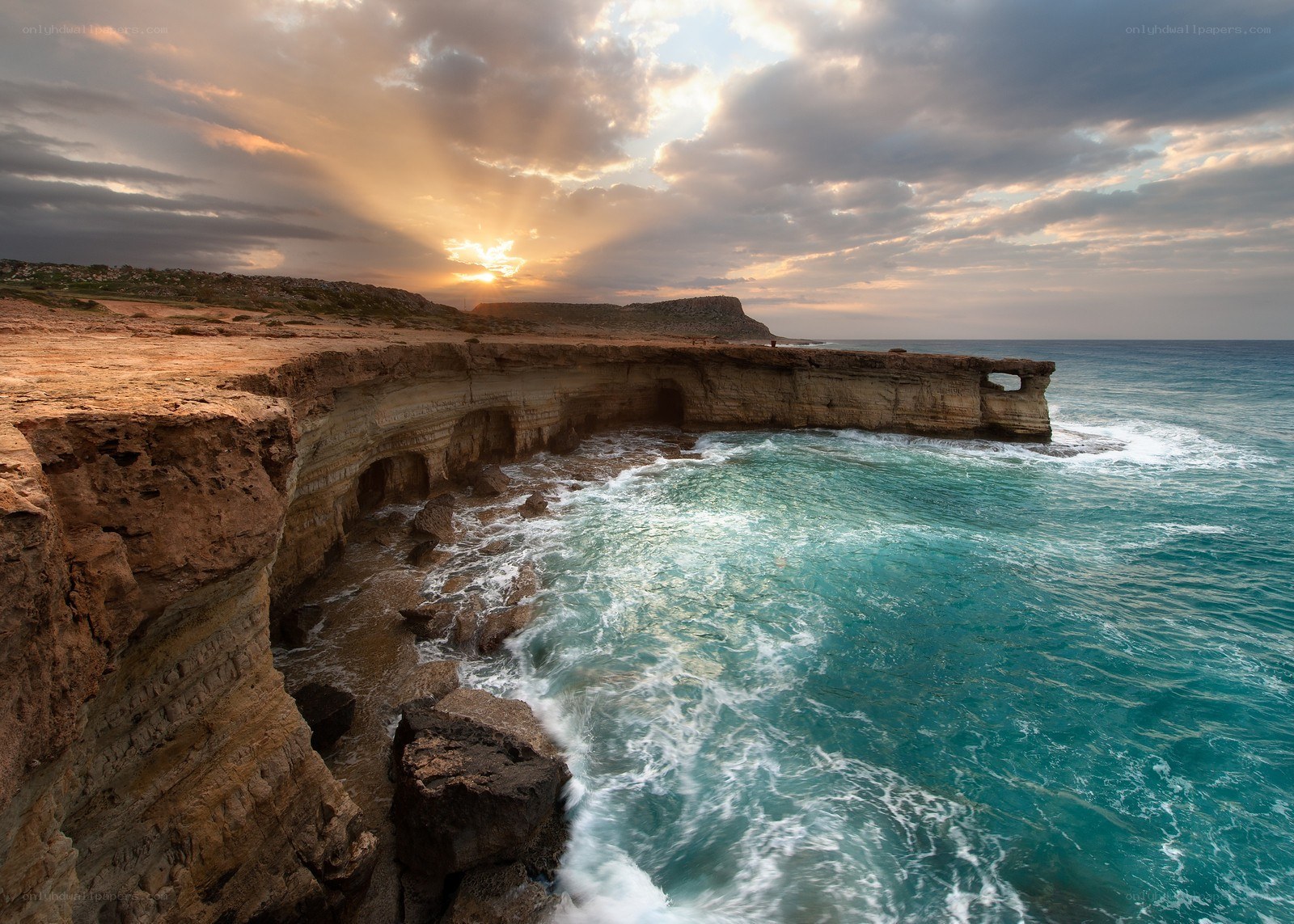 Cliffs at sunset by the sea