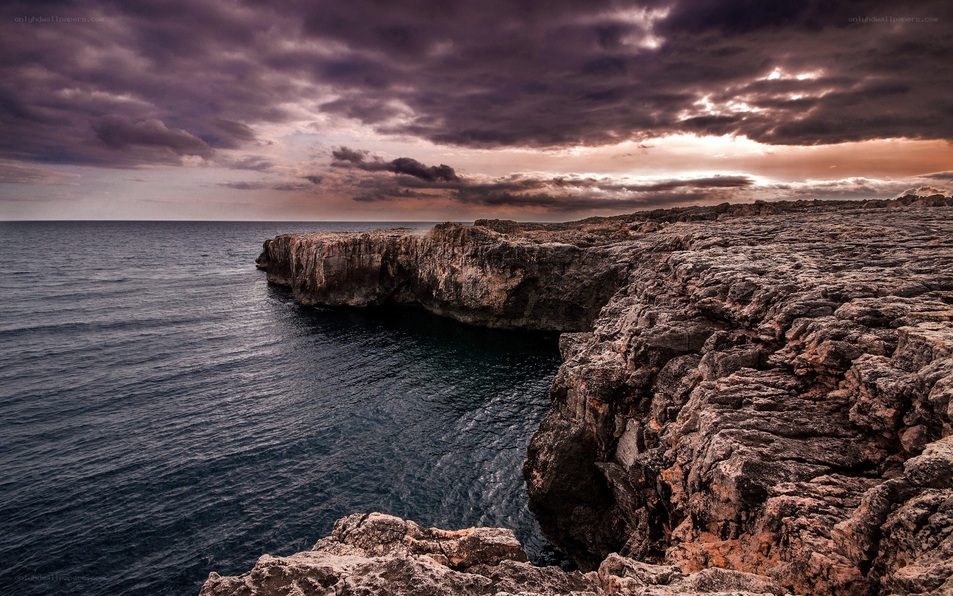 Cliffs at sunset by the sea