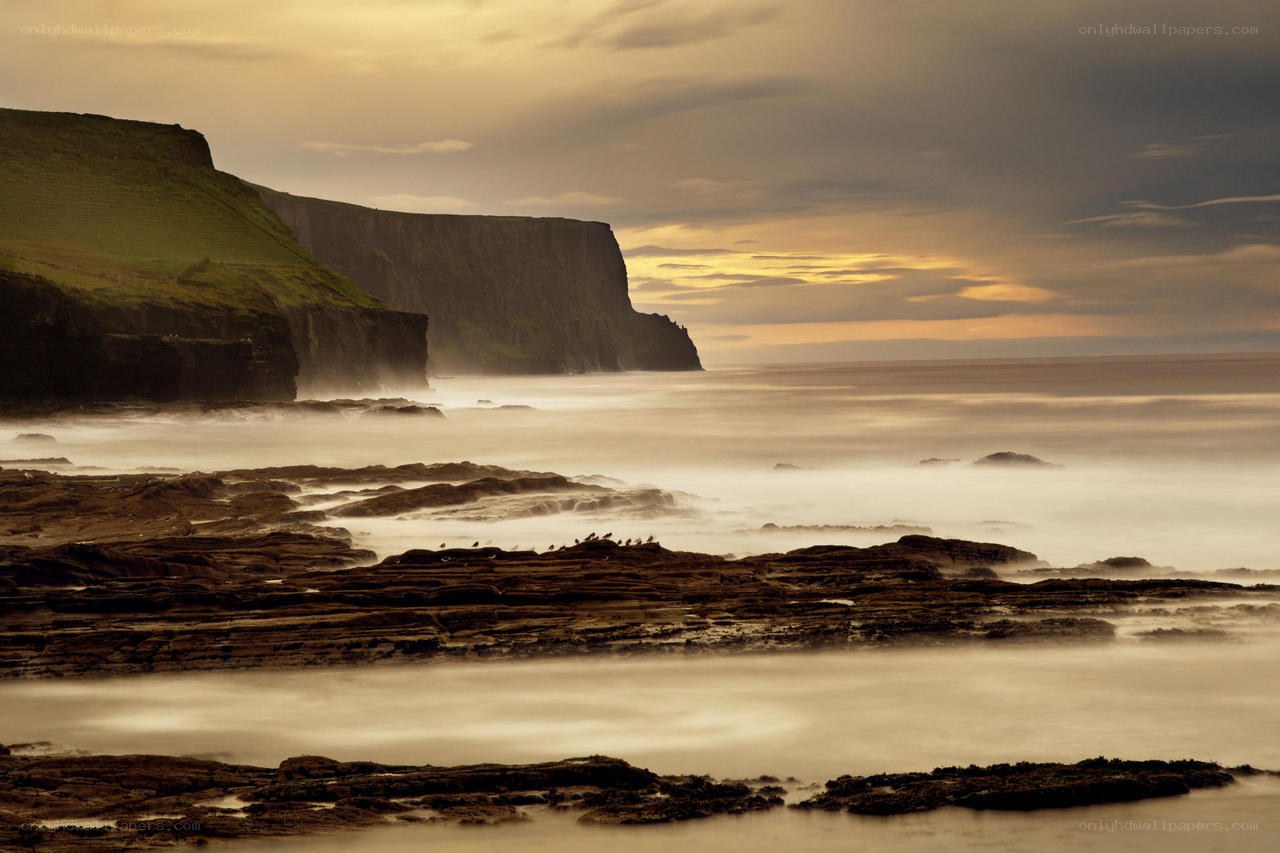 Cliffs at sunset by the sea