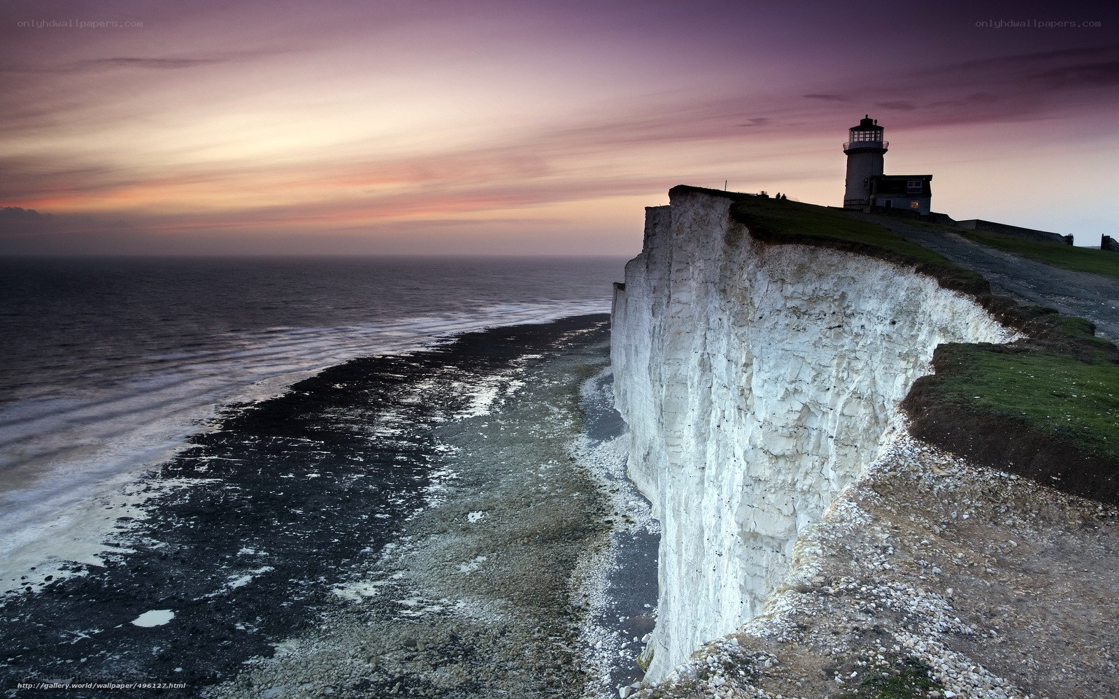 Cliffs at sunset with lighthouse