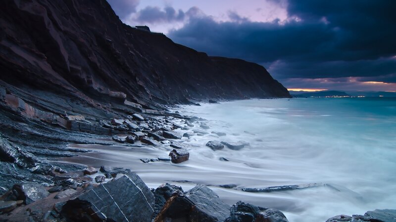 Cliffs at twilight by the sea