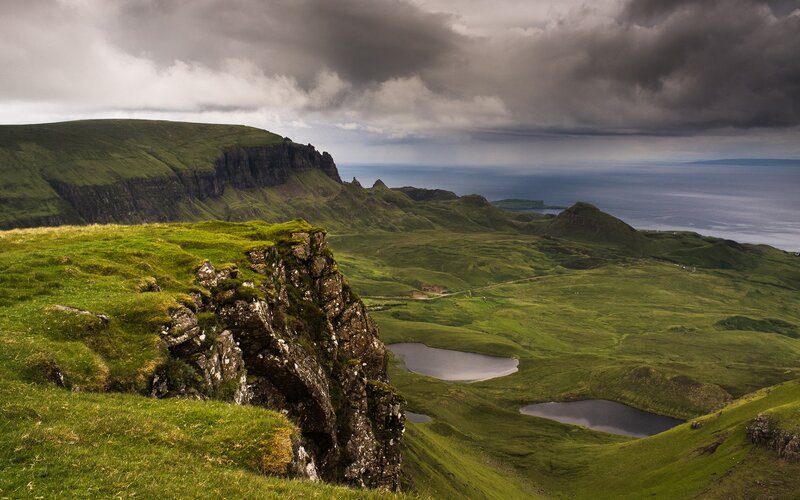 Cliffs overlooking a green valley