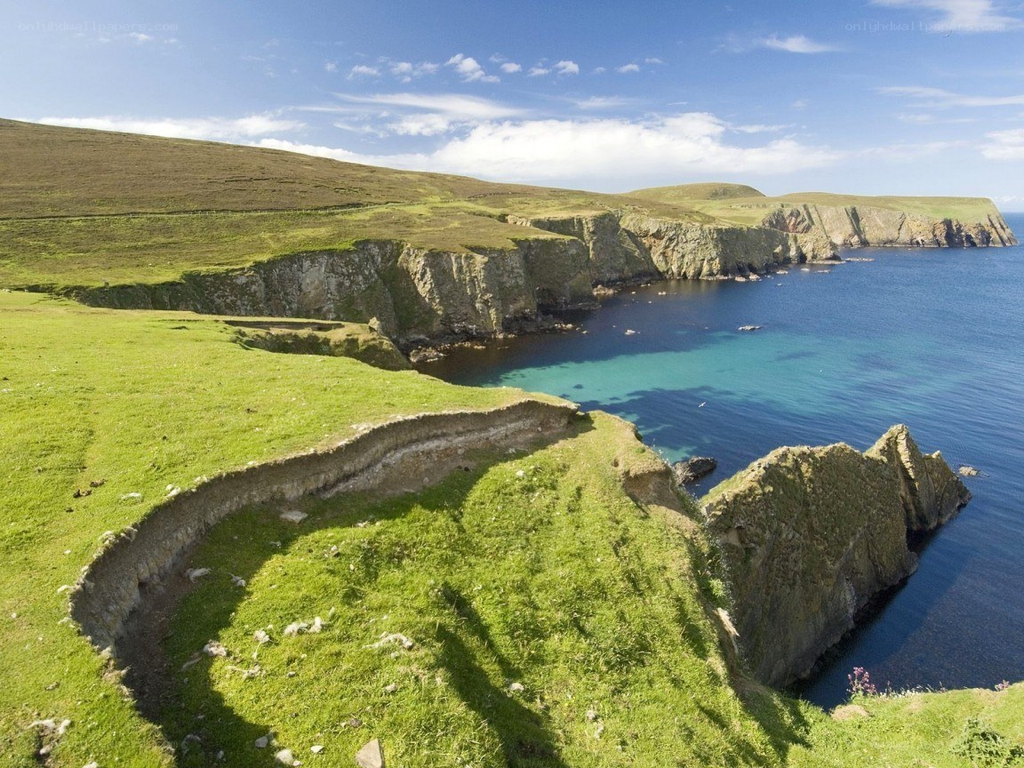 cliffs overlooking turquoise sea