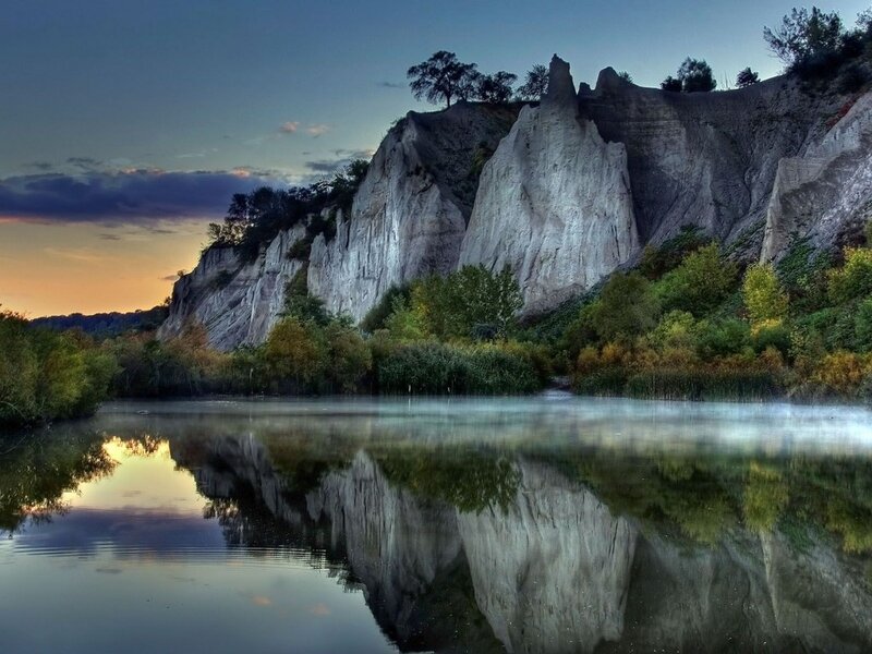 Cliffs Reflected in Lake — Blue, Serene, Sunset