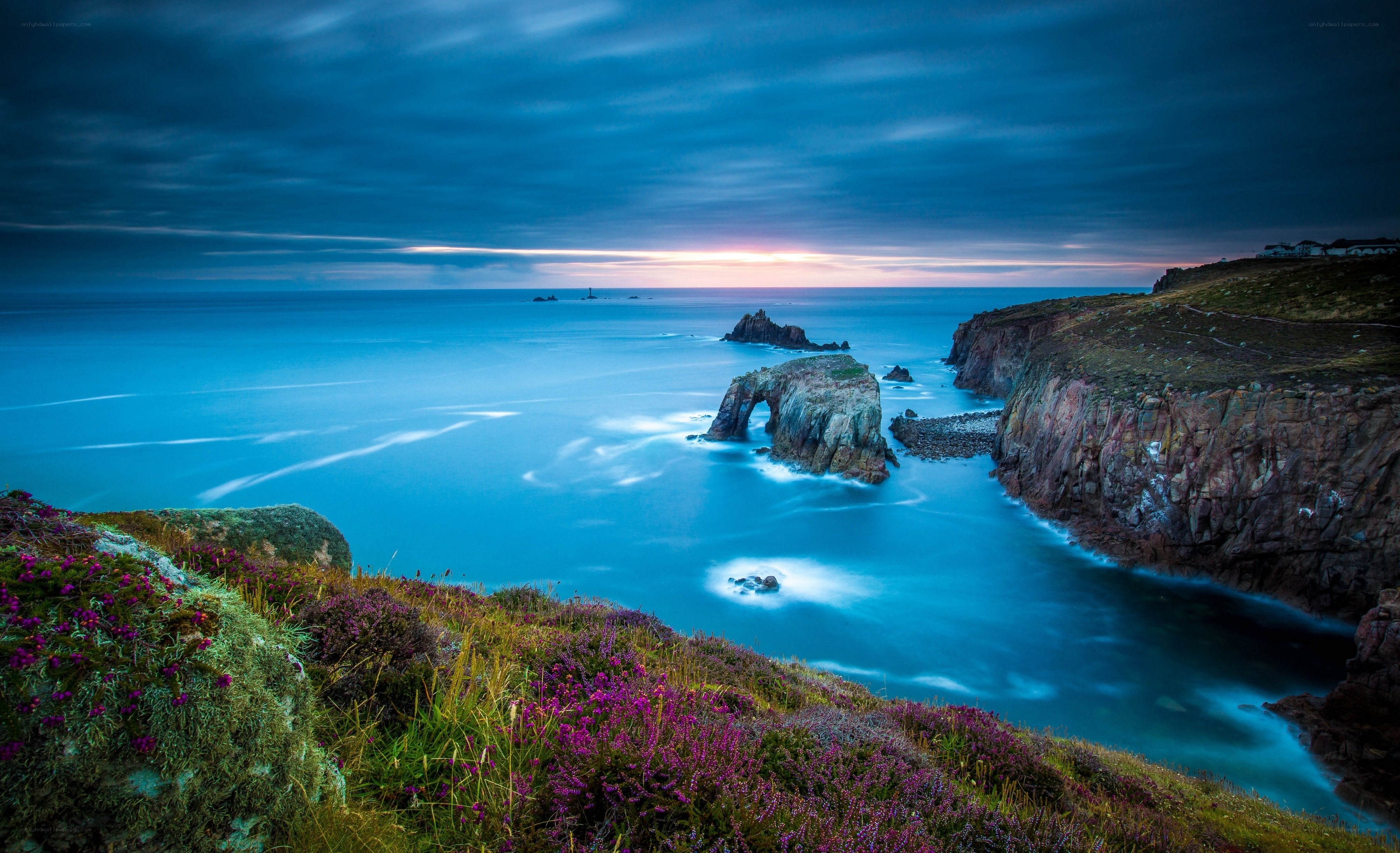Cliffs with sea arch at dusk
