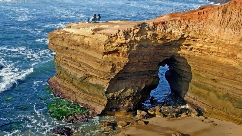 cliffside arch with couple