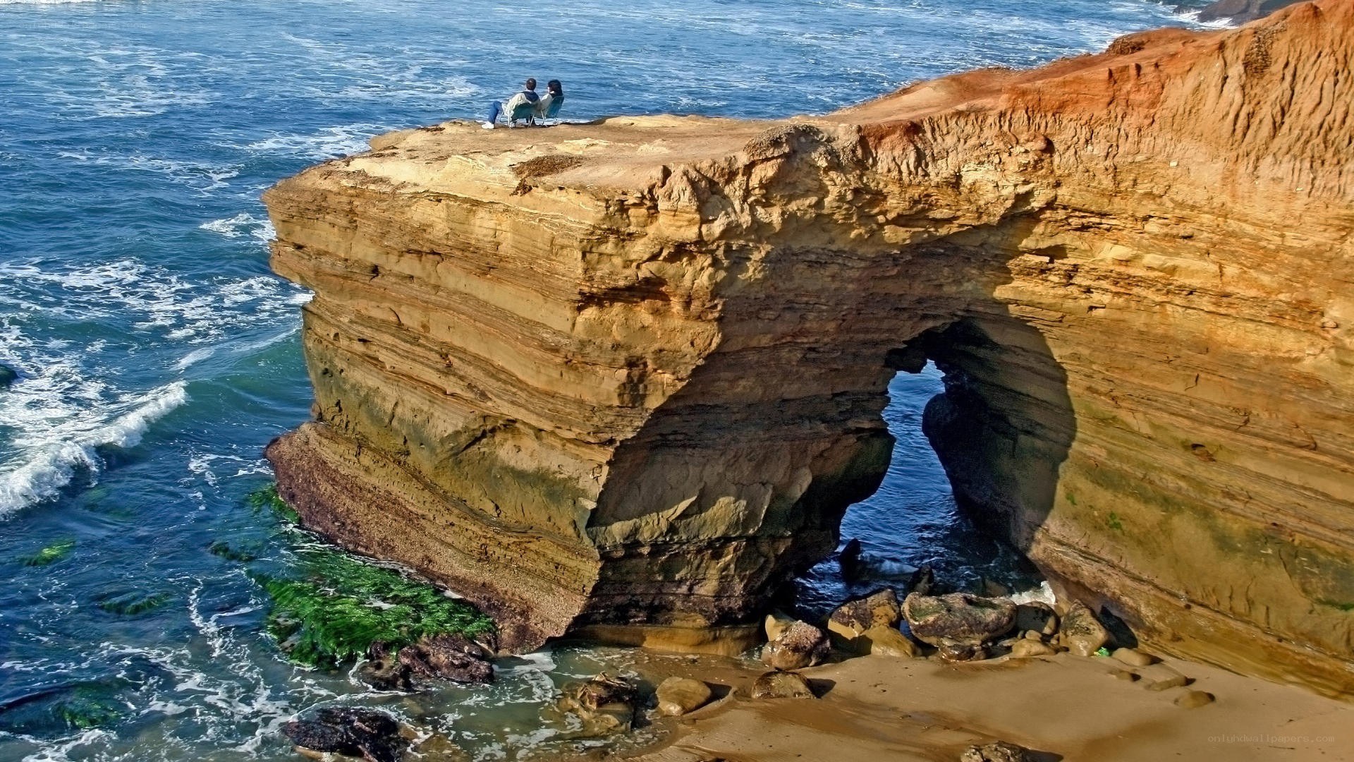 cliffside arch with couple