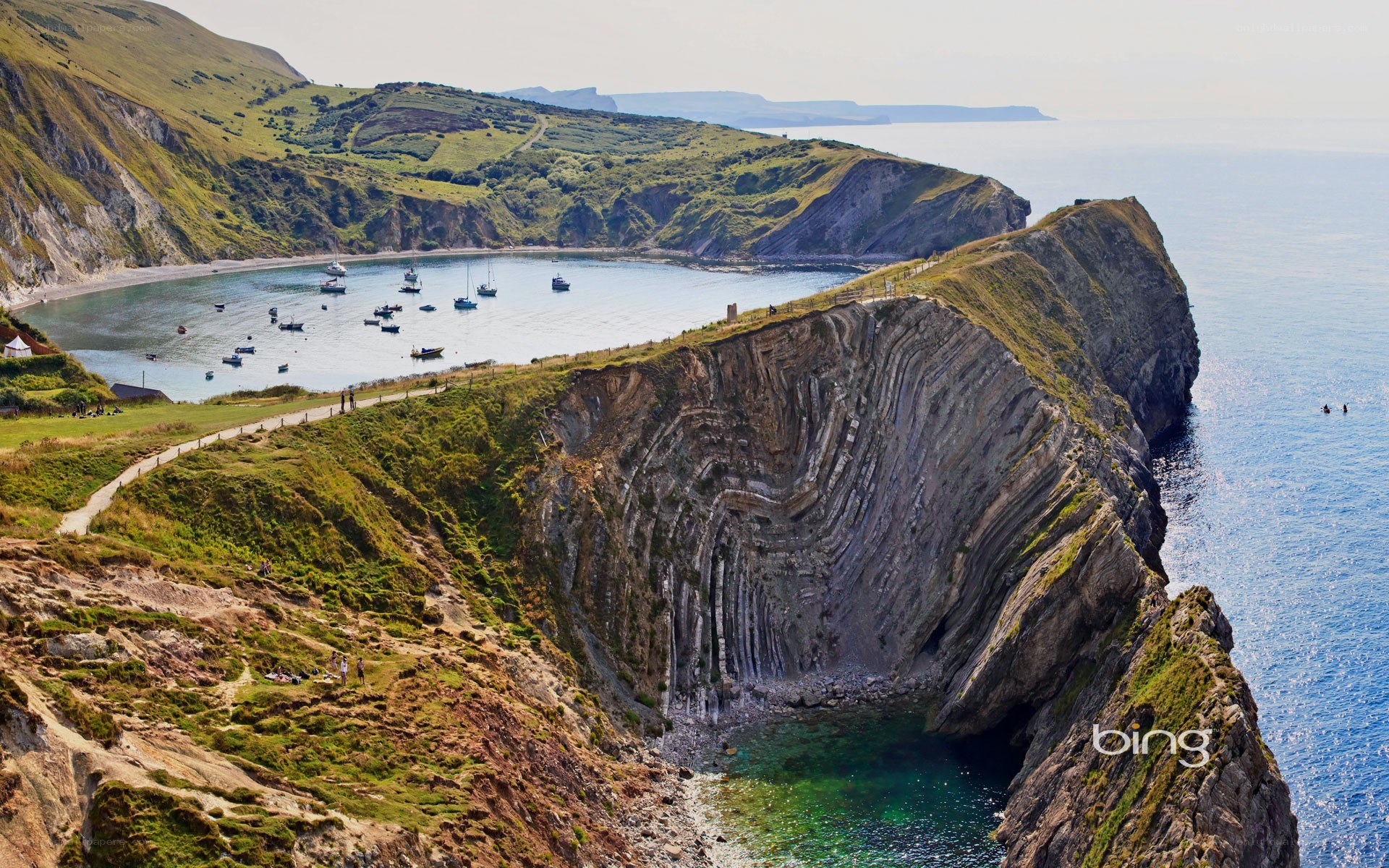 cliffside bay with boats