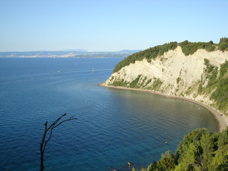 Cliffside Bay with Boats — Blue