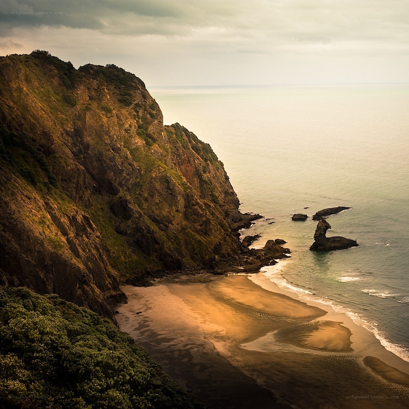 cliffside beach at golden hour