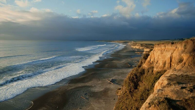 cliffside beach at sunset