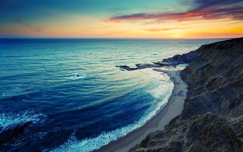 Cliffside Beach at Sunset — Blue, Serene, Photograph, Ocean, Sky