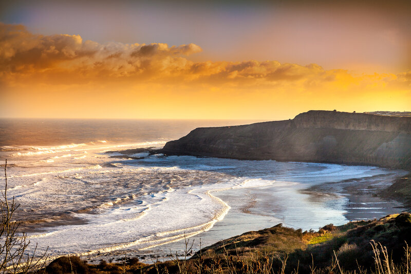 Cliffside Beach at Sunset — Orange, Dramatic, Photograph, Ocean