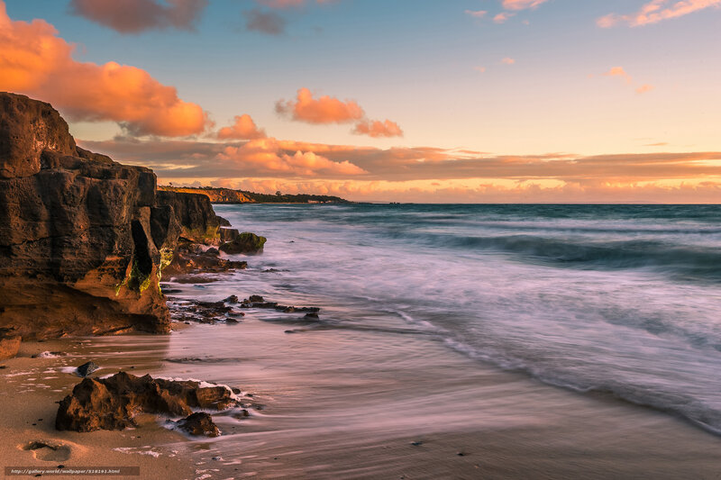 Cliffside Beach at Sunset — Orange, Serene, Photograph, Ocean, Clouds