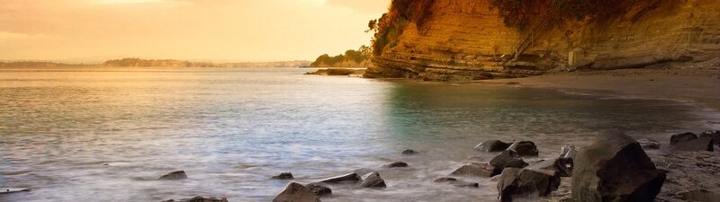 Cliffside Beach at Sunset — Orange, Serene, Photograph, Ocean, Rocks, Cliffs