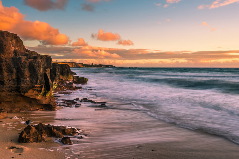 Cliffside Beach at Sunset — Orange, Serene, Photograph, Ocean