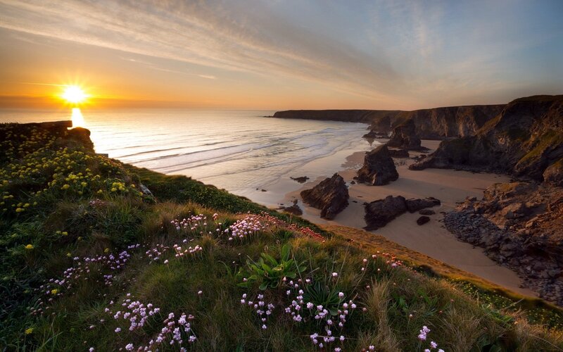 Cliffside Beach at Sunset — Orange, Serene, Photograph, Sun