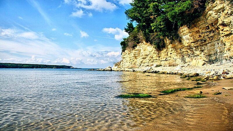 cliffside beach with clear water