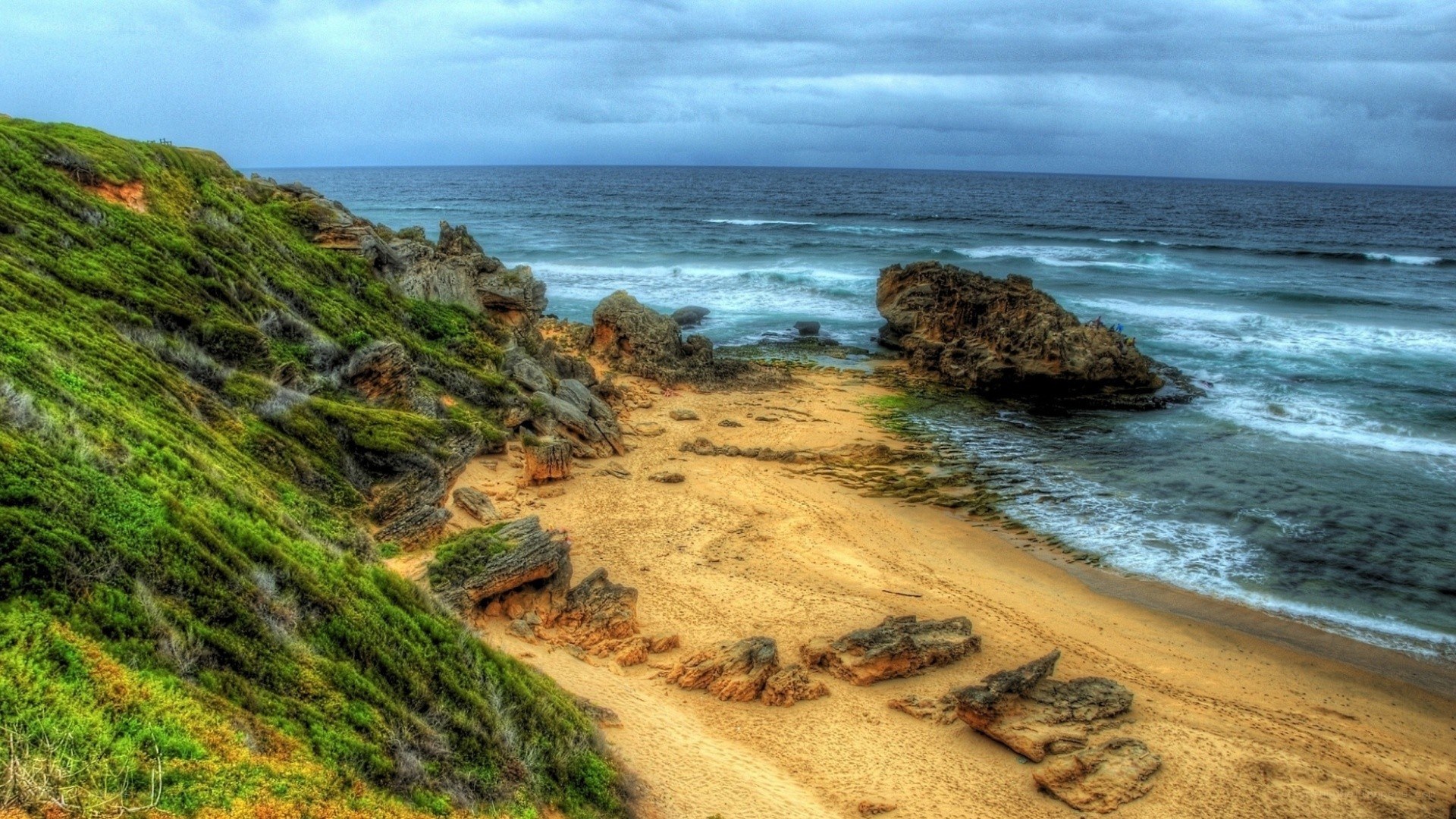 cliffside beach with crashing waves