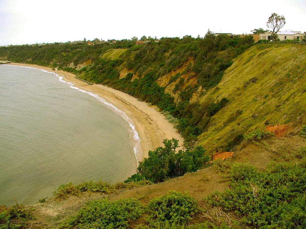 cliffside beach with houses
