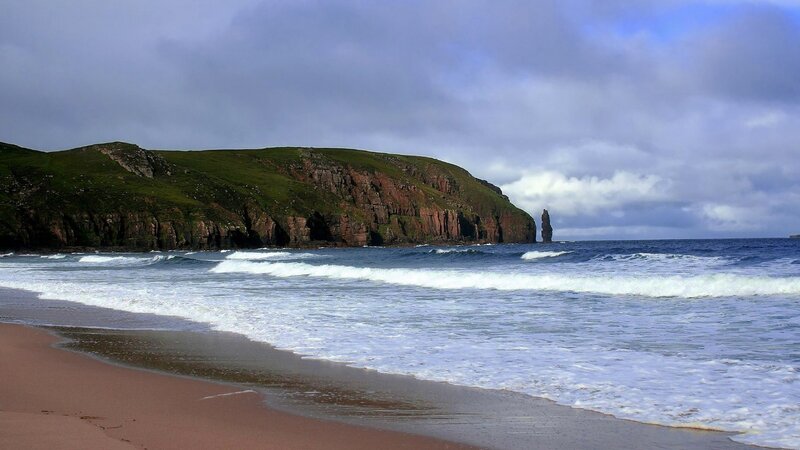 cliffside beach with sea stack
