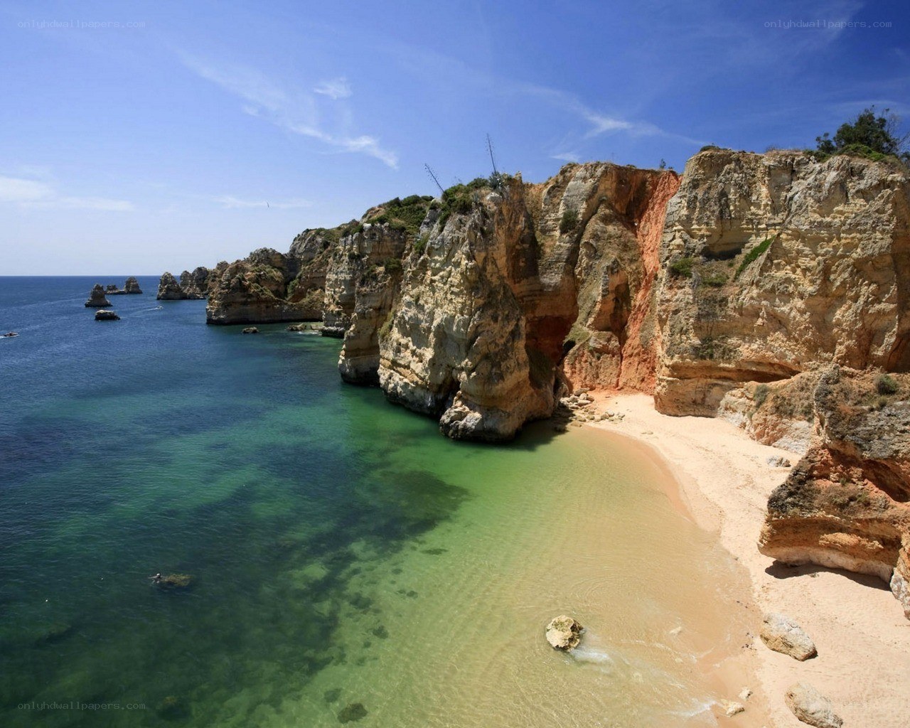 cliffside beach with turquoise water
