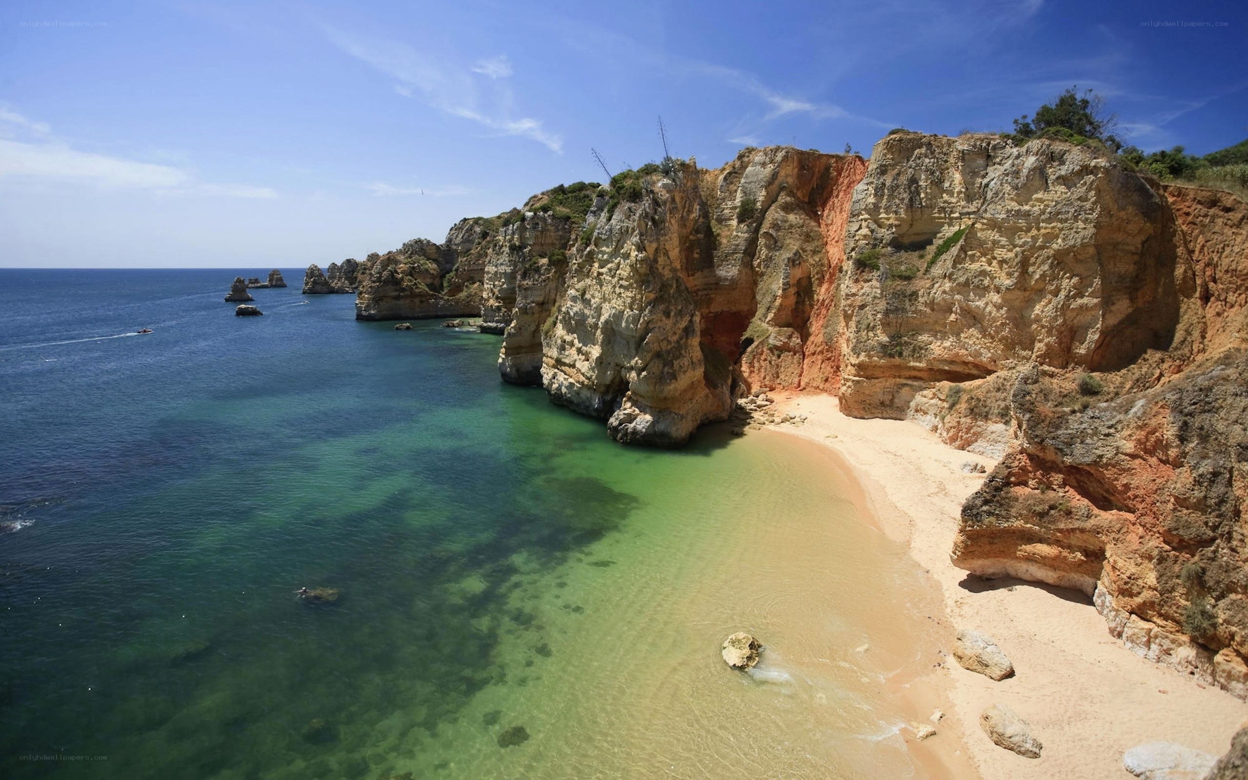 cliffside beach with turquoise water