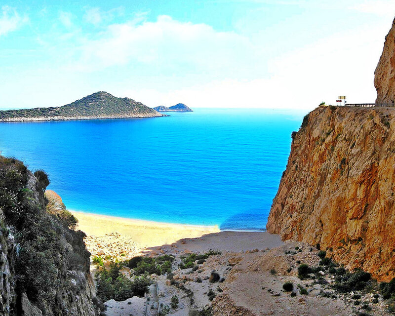 cliffside beach with turquoise water