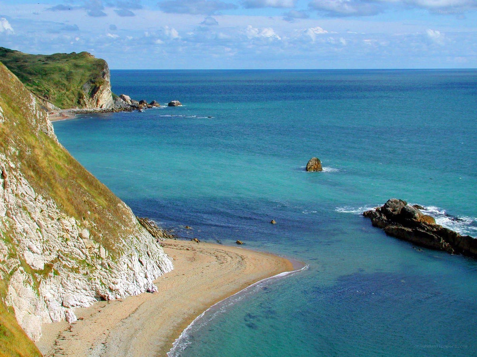 cliffside beach with turquoise water