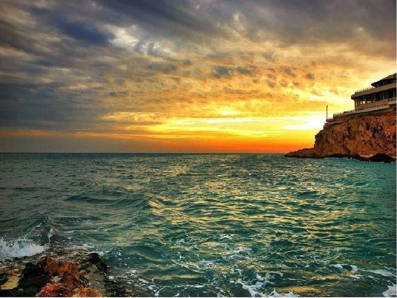 Cliffside Building at Sunset — Orange