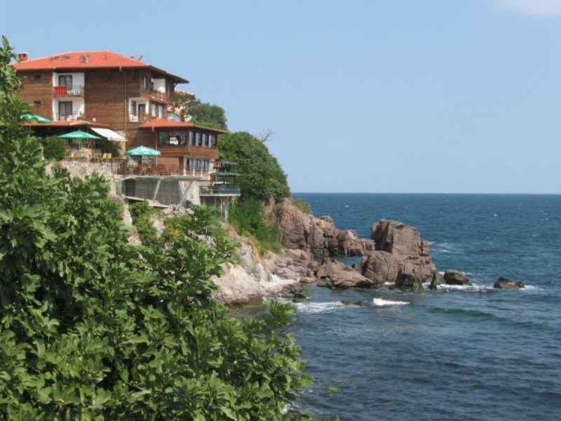 Cliffside Building by Sea