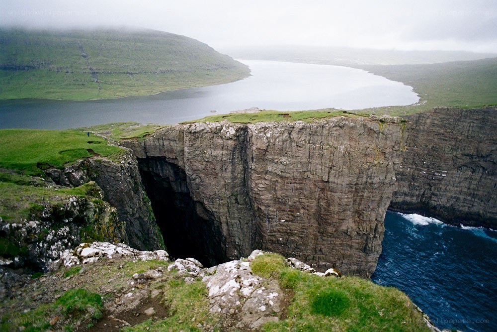 cliffside cave overlooking a fjord