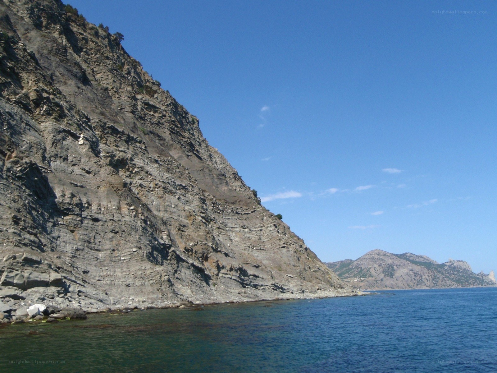 Cliffside coast under blue sky