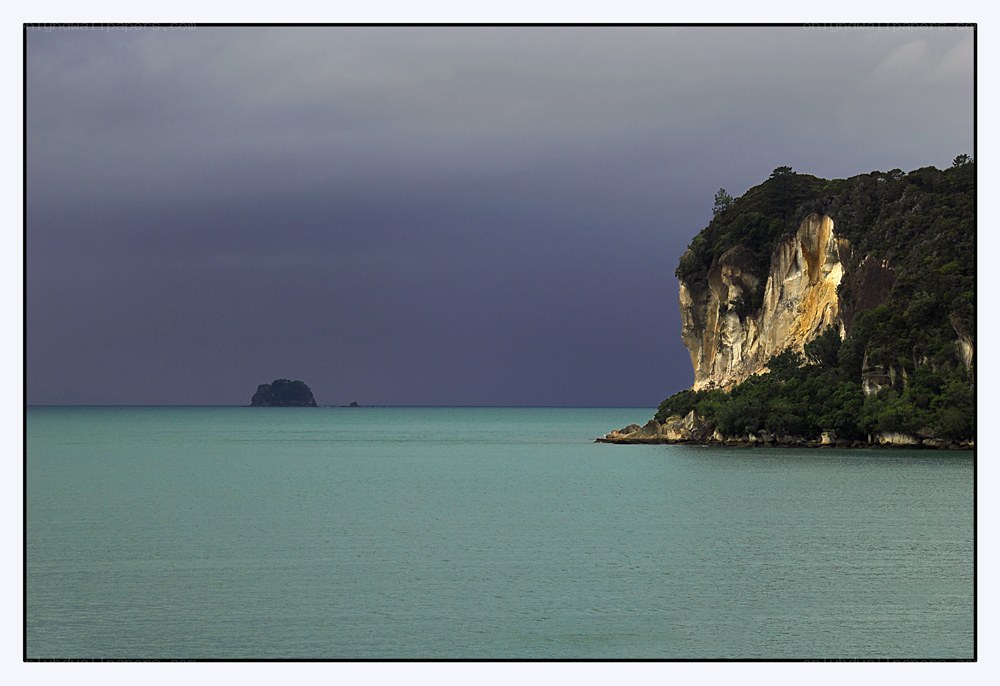 Cliffside coast under stormy sky