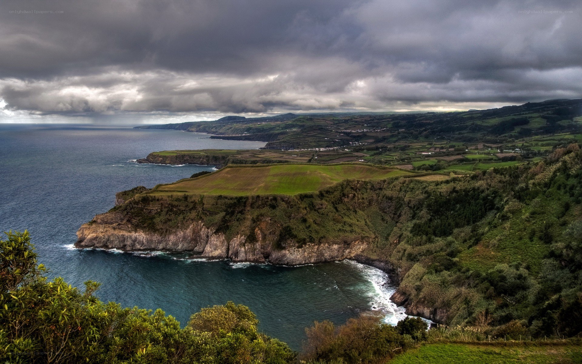 cliffside coast under stormy sky