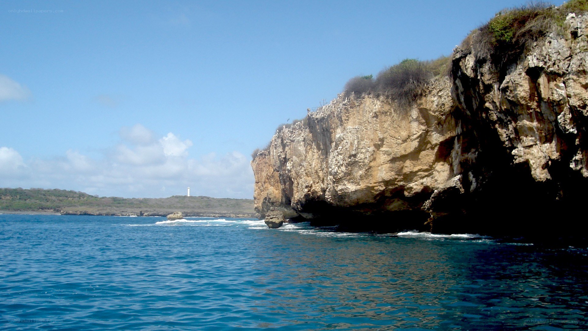 cliffside coast with lighthouse
