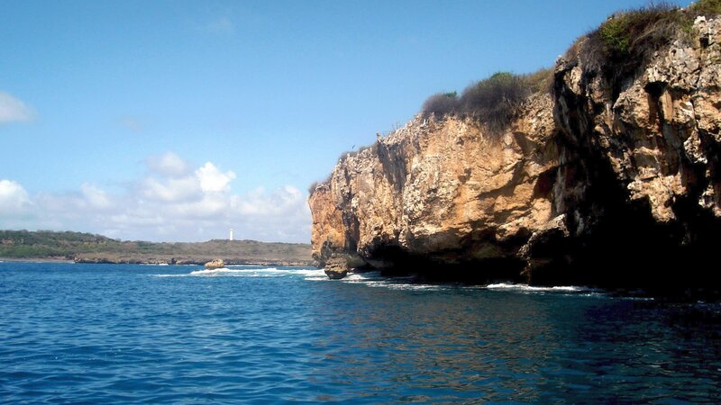 cliffside coast with lighthouse
