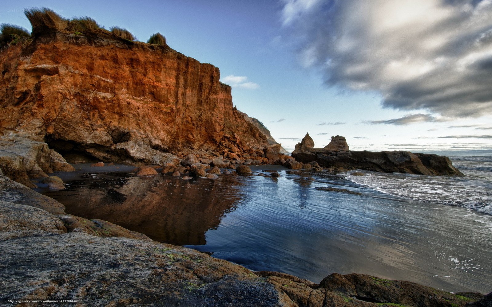 Cliffside coastal scene at dusk