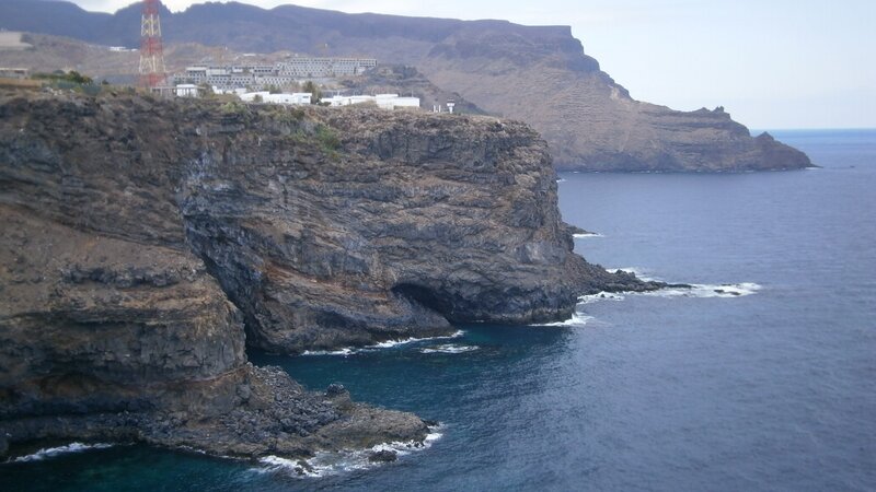 Cliffside Coastal Town — Blue, Dramatic, Afternoon, Photograph, Ocean