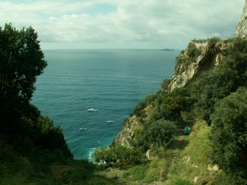 cliffside coastal view with boats