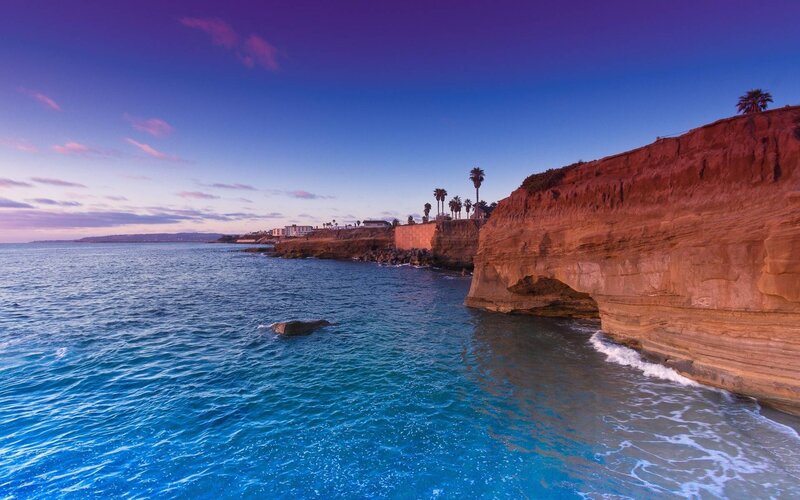 Cliffside Coastline at Dusk — Blue, Serene, Sunset, Photograph