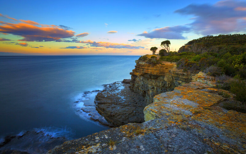 Cliffside Coastline at Sunset — Blue, Serene, Photograph