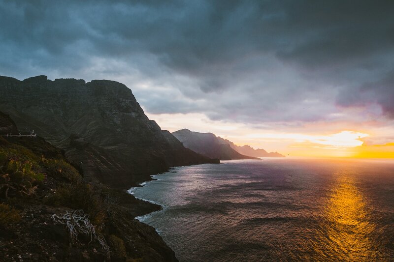 Cliffside Coastline at Sunset — Orange, Dramatic