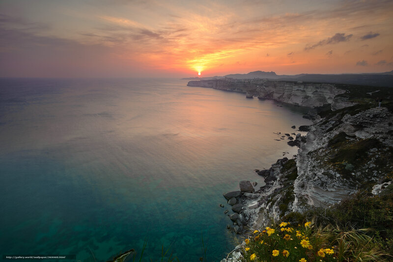 Cliffside Coastline at Sunset — Orange, Serene, Photograph, Sun
