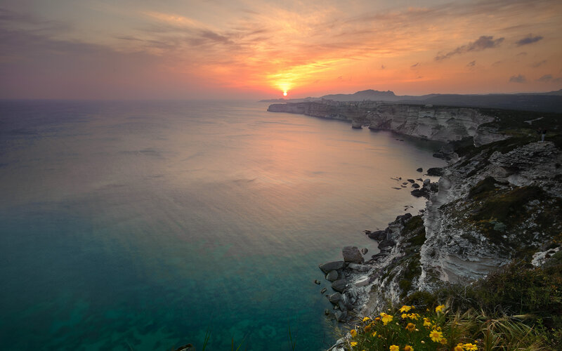 Cliffside Coastline at Sunset — Orange