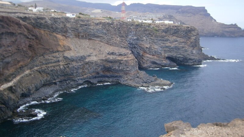 Cliffside Coastline — Blue, Dramatic, Afternoon, Photograph, Ocean, Buildings