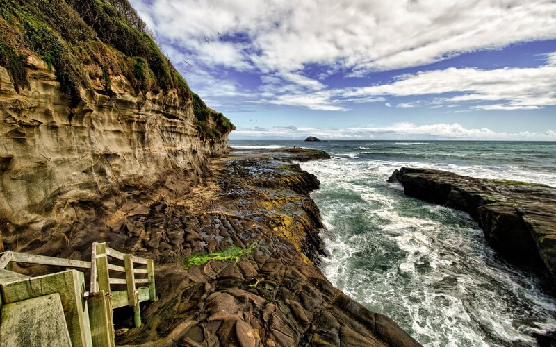 Cliffside Coastline — Blue, Dramatic, Afternoon, Photograph, Ocean, Rocks, Wooden Stairs