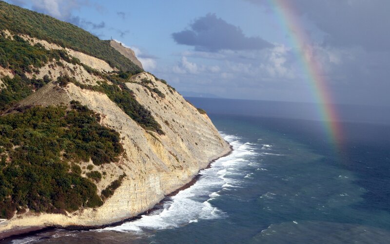Cliffside Coastline — Blue, Dramatic, Afternoon, Photograph, Rainbow