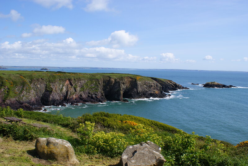 Cliffside Coastline — Blue, Serene, Afternoon, Photograph, Ocean, Rocks, Grass, Green